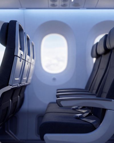 Aircraft passenger seats inside a modern economy-class cabin
